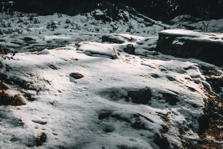 Semi covered stones by snow
