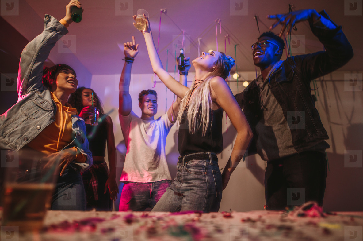 people dancing at a house party