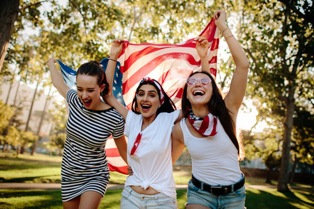 Enthusiastic American girls celebrating independence day