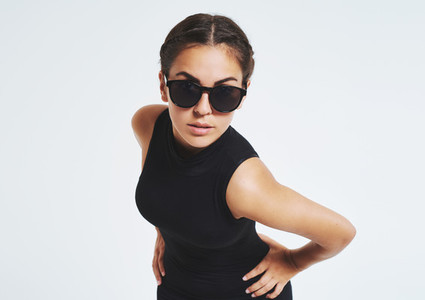 Provocative young woman in trendy sunglasses