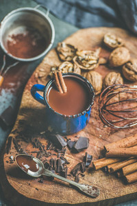 Homemade rich hot chocolate with nuts and cinnamon