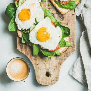 Healthy breakfast sandwiches and cup of coffee  square crop