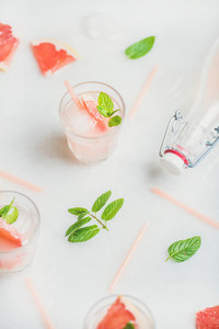 Cold refreshing summer alcohol cocktail with fresh grapefruit