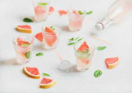 Cold refreshing summer alcohol cocktail with fresh grapefruit pieces