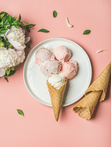 Pink strawberry and coconut ice cream cones and white peonies
