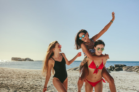 Woman friends enjoying on beach