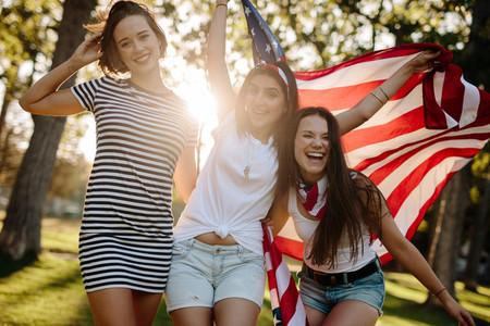 Female friends with American flag