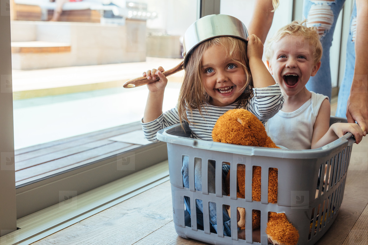 Kids rides in a laundry basket stock photo (147806) - YouWorkForThem