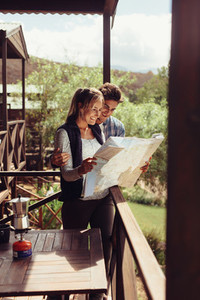 Couple looking at tourist place on map
