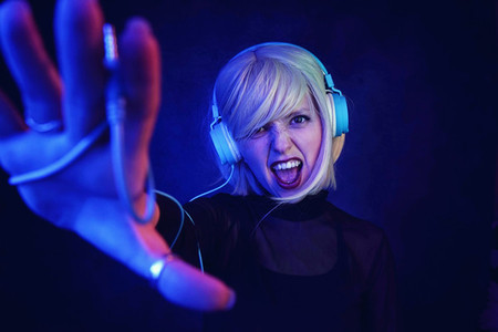 Young DJ woman at a party