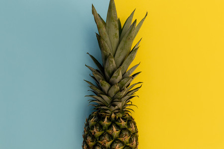 Pineapple fruit on yellow background minimal summer food concept