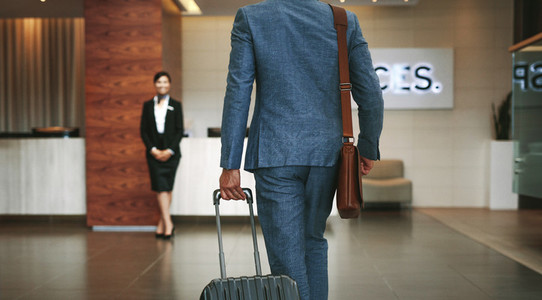 Business traveler arriving at hotel
