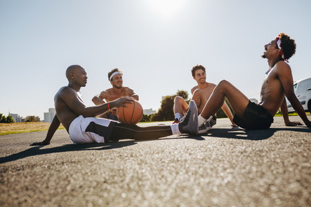 Men relaxing during a basketball game
