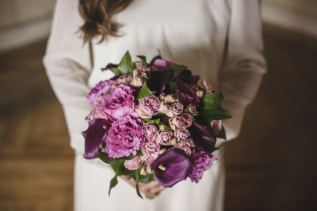 Bride holding her colorful bridal bouquet