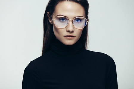 Woman in glasses with intense expression