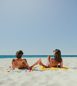 Women sunbathing on beach