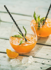 Refreshing cold alcoholic summer citrus cocktail with orange