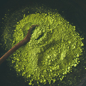 Japanese Matcha green tea powder in bowl  square crop