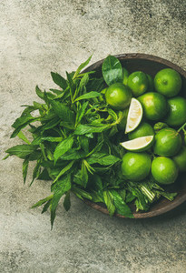 Flatlay of fresh limes and mint top view