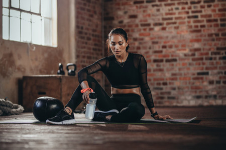 Fit woman resting after workout