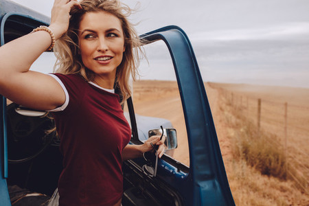 Woman on road trip in countryside