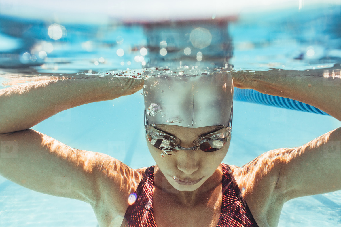 Photos - Woman swimmer inside swimming pool - YouWorkForThem