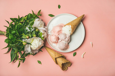 Pink strawberry and coconut ice cream  cones  white peony flowers