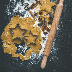 Baking ingredients for Christmas holiday traditional gingerbread cookies preparation  black background