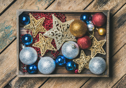 Christmas tree toy stars  balls and garland in wooden box