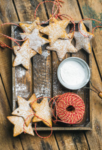 Christmas star shaped cookies with sugar powder and decoration rope