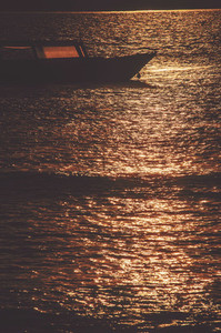 Boat at sea during sunset