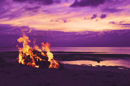 Bonfire on the beach at sunset