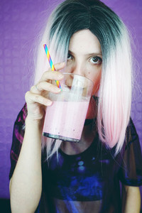 Fit woman drinking a smoothie