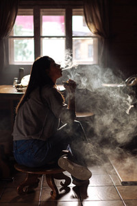 The girl smoke electronic cigarette