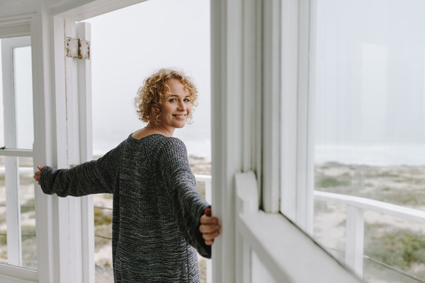 Smiling Tourist Woman Standing At The Door Of A Hotel Photo (245429 ...