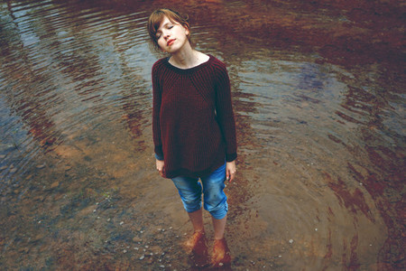 Young woman in a river