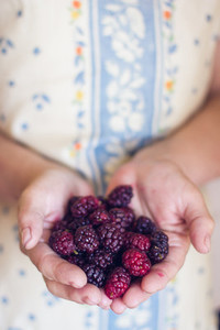 Woman holding blackberries