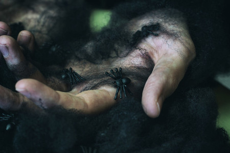 Hands and black spiderweb