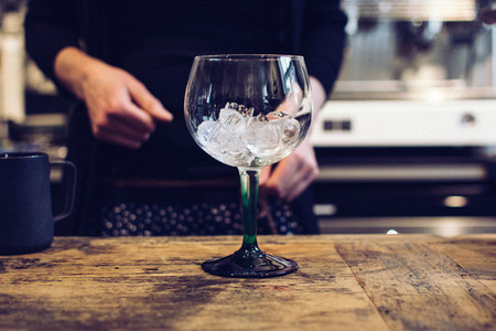 Empty wine glass with ice
