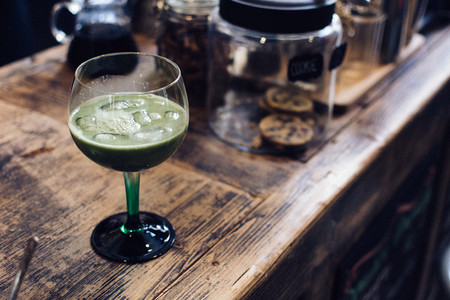 Iced matcha cocktail in cafe