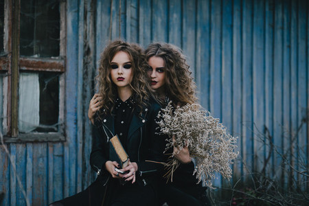 Two vintage witches gathered eve of Halloween