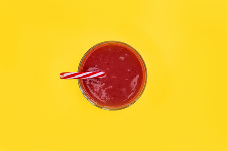 Red smoothie strawberry drink isolated yellow background