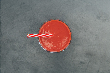 Red smoothie strawberry drink dark background