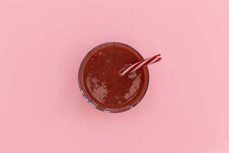 Red smoothie strawberry drink isolated pink background
