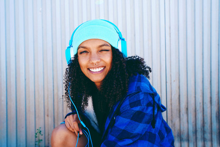 Young beautiful woman listening to music