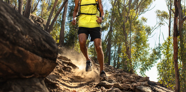 Trail runner on challenging rocky terrain