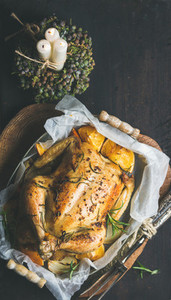 Christmas dinner with roasted chicken rosemary and decorative candles