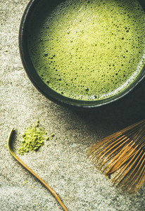 Flat lay of freshly brewed Japanese matcha tea in Chasen bowl