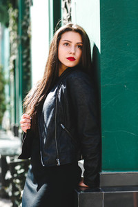 Glamorous young woman in black leather jacket