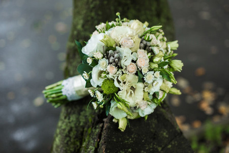 Very beautiful bridal bouquet lying on the table